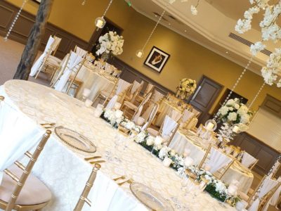 Gold chivari chairs with ivory draylon seat pad and chair drape