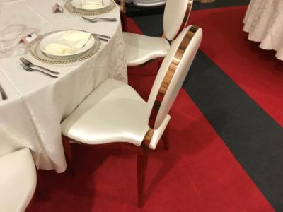 Rose Gold Louis Dior chairs with satin table cloths wedding and event chairs